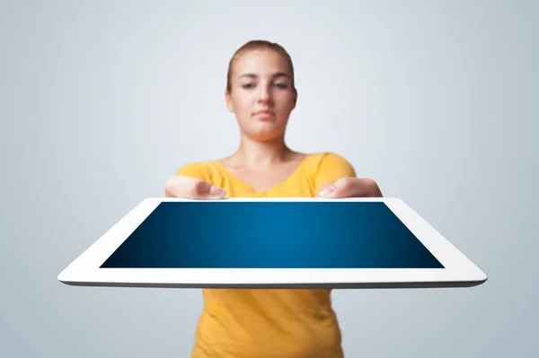 Young woman holding modern tablet — Stock Photo, Image