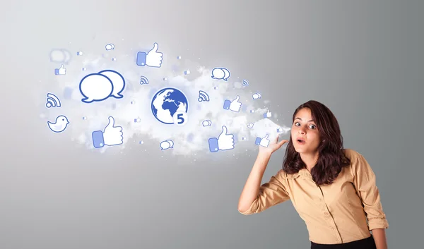 Beautiful woman gesturing with social network icons — Stock Photo, Image