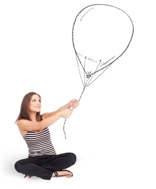 Güzel bir kadın balon çiziyor.