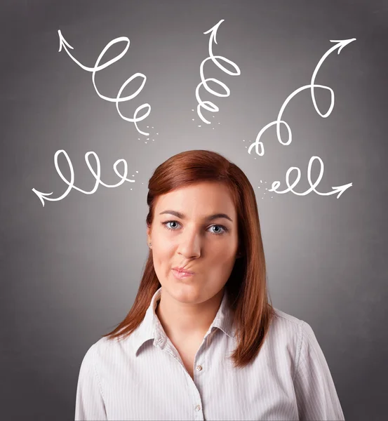 Young woman thinking with arrows overhead — Stock Photo, Image