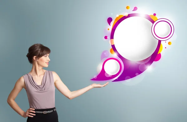 Attractive woman presenting abstract speech bubble copy space — Stock Photo, Image