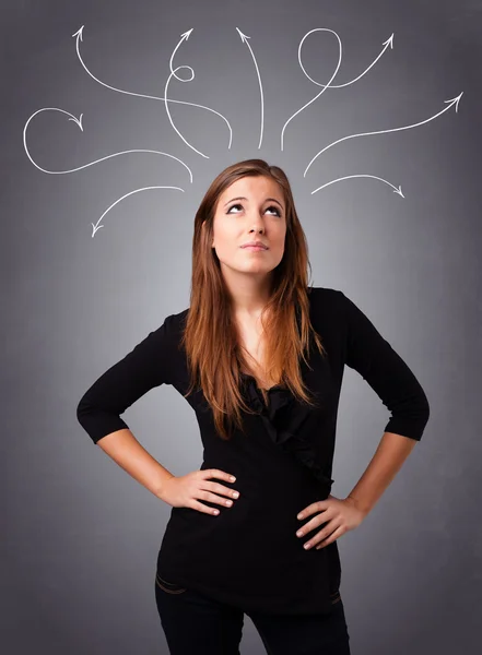Young girl thinking with arrows overhead — Stock Photo, Image