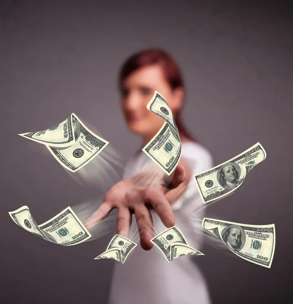 Young girl throwing money — Stock Photo, Image