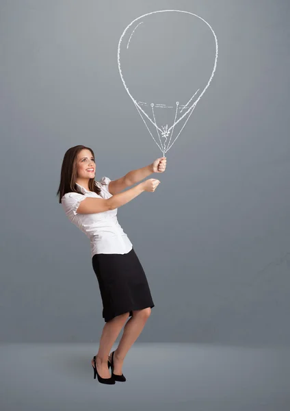 Vacker kvinna som håller ballong ritning — Stockfoto