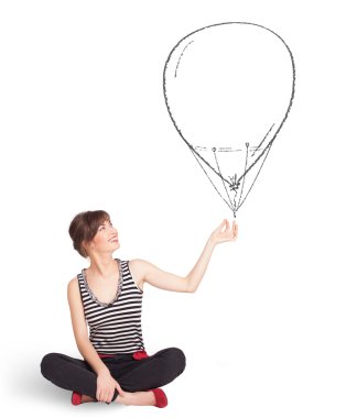 Güzel bir kadın balon çiziyor.