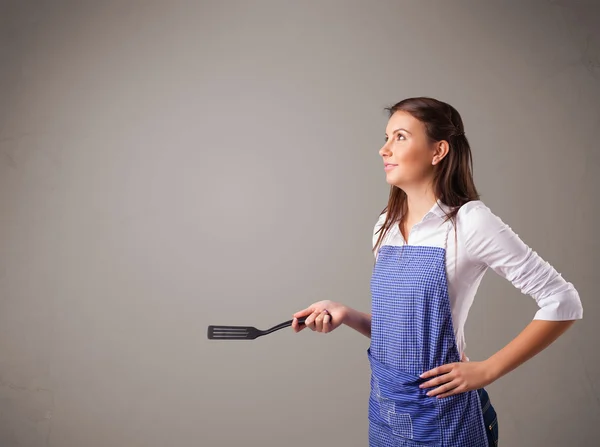 Pretty woman holding a spoon — Stock Photo, Image