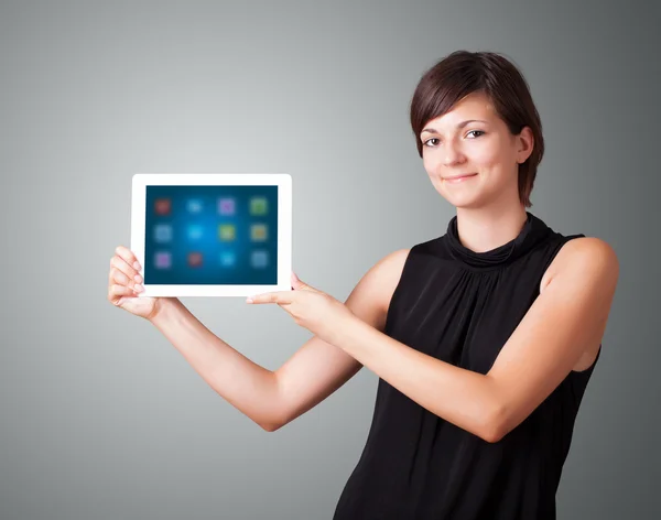 Mujer sosteniendo tableta moderna con iconos de colores —  Fotos de Stock