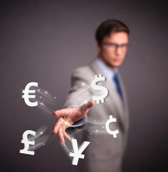 Attractive man throwing currency icons — Stock Photo, Image