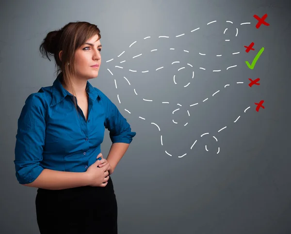 Young woman choosing between right and wrong signs — Stock Photo, Image