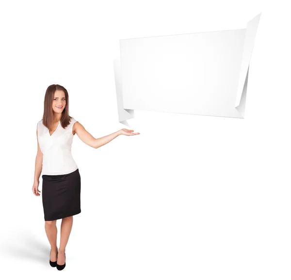 Young woman presenting abstract origami copy space — Stock Photo, Image