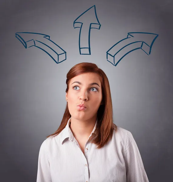 Pretty lady thinking with arrows overhead — Stock Photo, Image