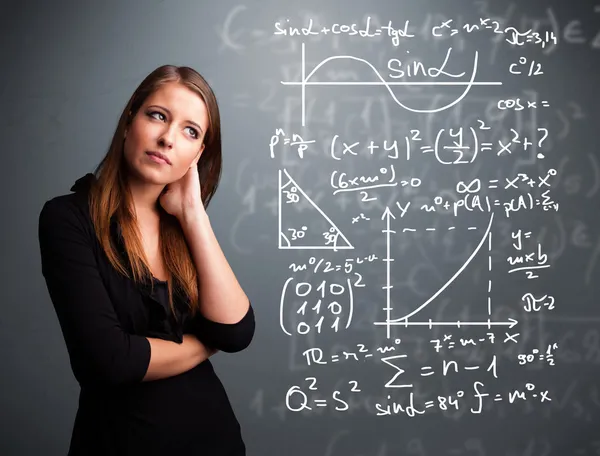 Krásná školačka přemýšlí o složitých matematických znamének — Stock fotografie