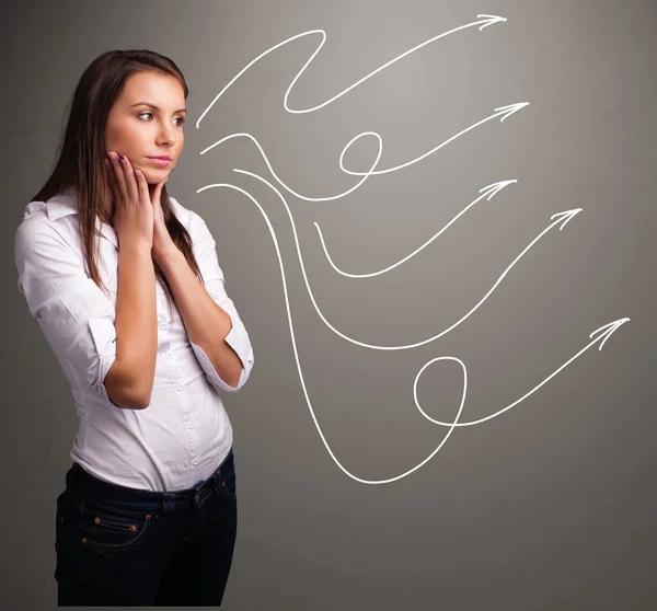 Attractive teenager looking at multiple curly arrows — Stock Photo, Image