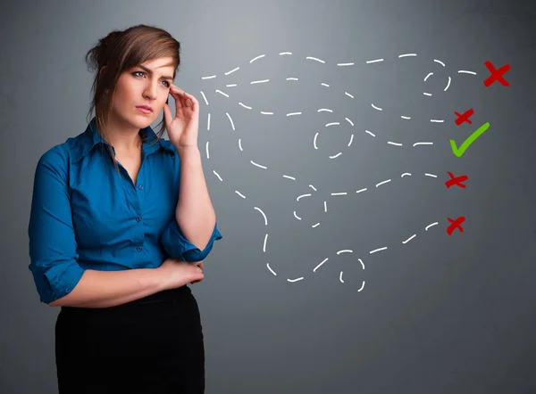 Young woman choosing between right and wrong signs — Stock Photo, Image