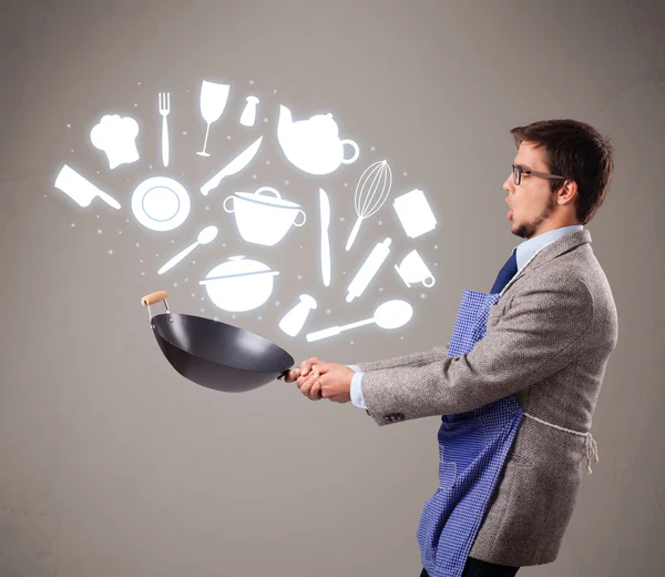 Hombre guapo con accesorios de cocina iconos —  Fotos de Stock