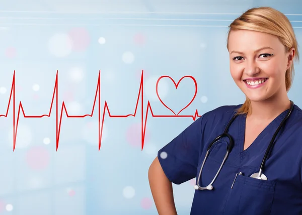 Young nurse listening to abstract pulse with red heart — Stock Photo, Image