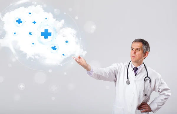 Doctor listening to abstract cloud with medical signs — Stock Photo, Image