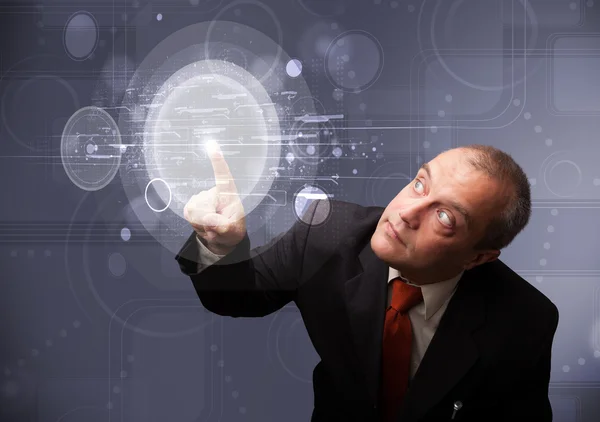 抽象的なハイテク円形のボタンに触れるビジネスマン — ストック写真