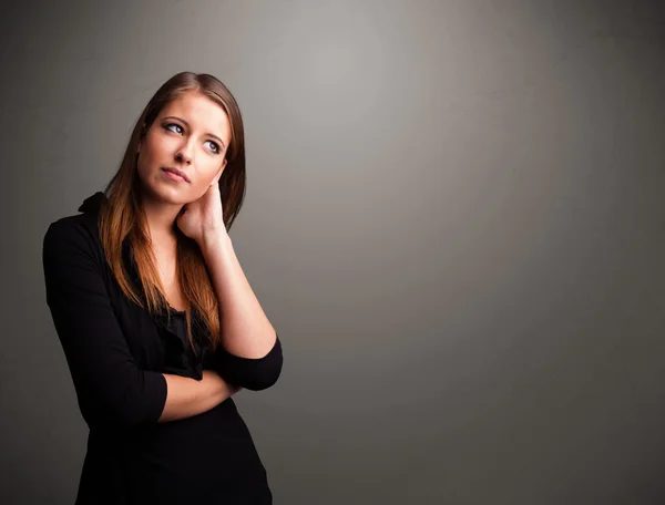 Beautiful woman thinking with empty copy space — Stock Photo, Image