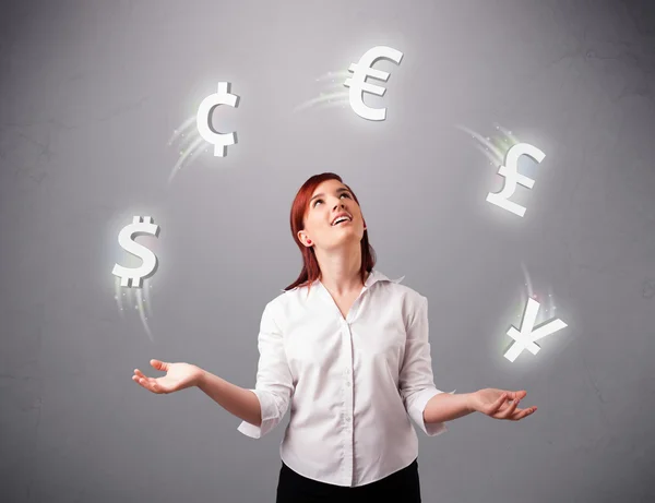 Young lady standing and juggling with currency icons — Stock Photo, Image