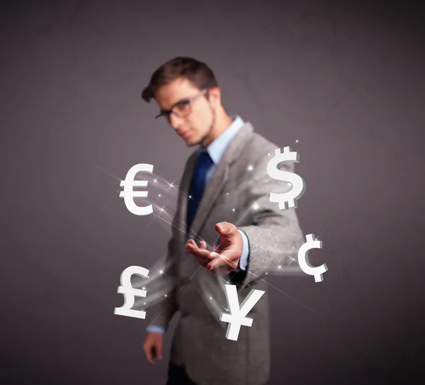 Attractive man throwing currency icons — Stock Photo, Image