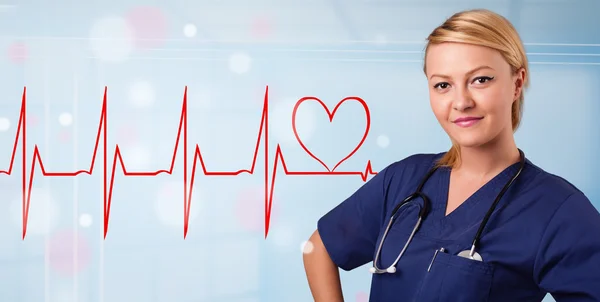 Young nurse listening to abstract pulse with red heart — Stock Photo, Image