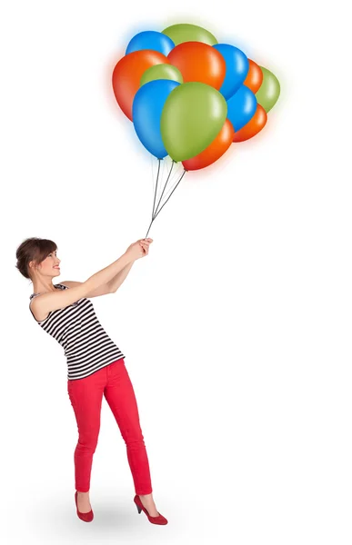 Junge Frau mit bunten Luftballons — Stockfoto