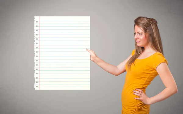 Young woman holding white paper copy space with diagonal lines — Stock Photo, Image