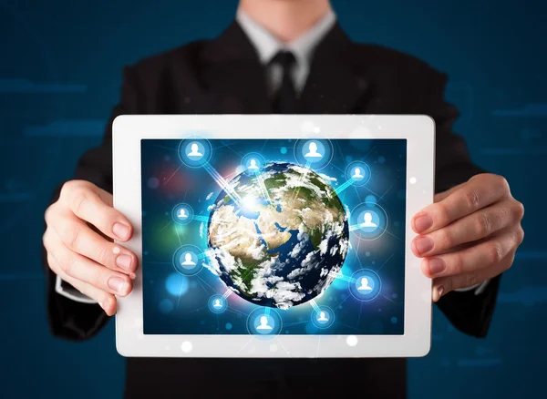 Businessman presenting 3d earth globe in tablet — Stock Photo, Image