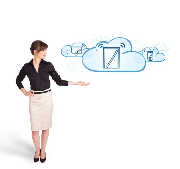 Young woman presenting modern devices in clouds — Stock Photo, Image