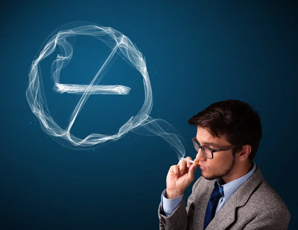 Young man smoking unhealthy cigarette with no smoking sign — Stock Photo, Image