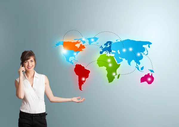 Young woman making phone call with colorful world map — Stock Photo, Image