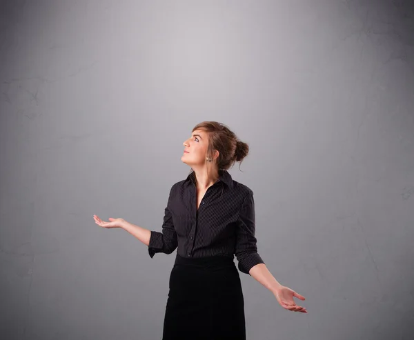 Beautiful young lady juggling with copy space — Stock Photo, Image