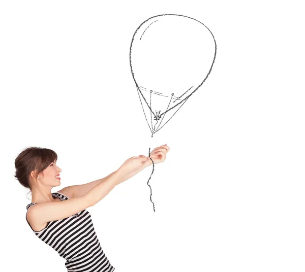 Pretty woman holding balloon drawing — Stock Photo, Image