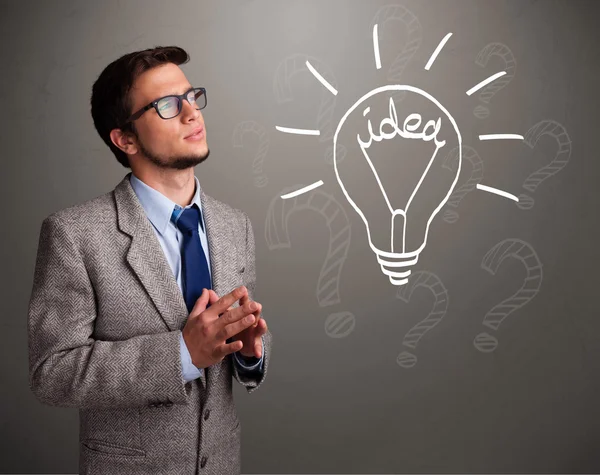 Young boy comming up with a light bulb idea sign — Stock Photo, Image