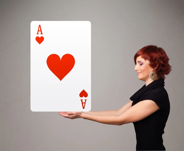 Beautifu woman holding a red heart ace — Stock Photo, Image