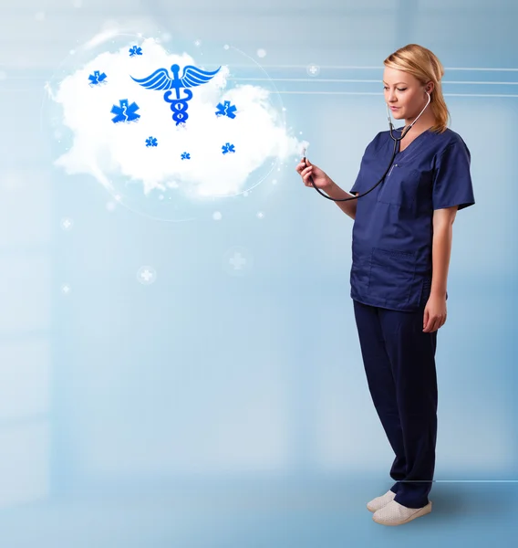 Young doctor with abstract cloud and medical icons — Stock Photo, Image