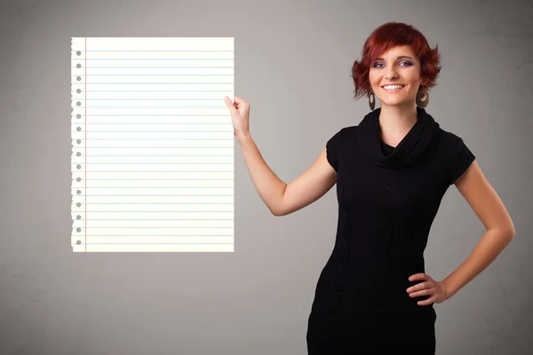 Young woman holding white paper copy space with diagonal lines — Stock Photo, Image