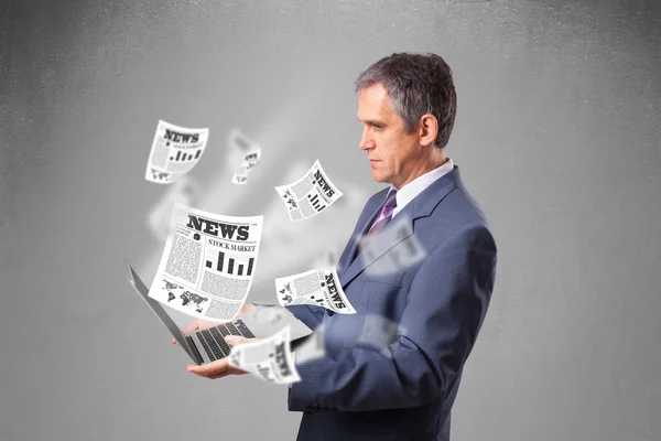 Middle aged businessman holding notebook and reading the explosi — Stock Photo, Image