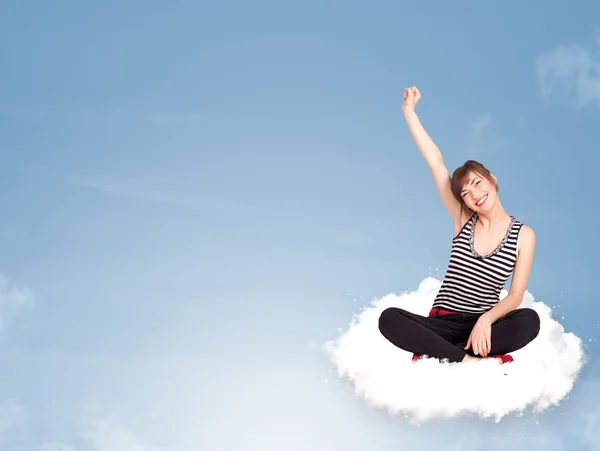 Young woman sitting on cloud with copy space — Stock Photo, Image