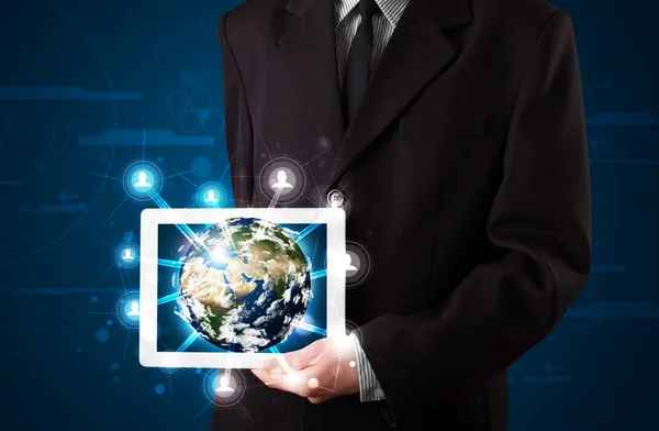 Businessman presenting 3d earth globe in tablet — Stock Photo, Image