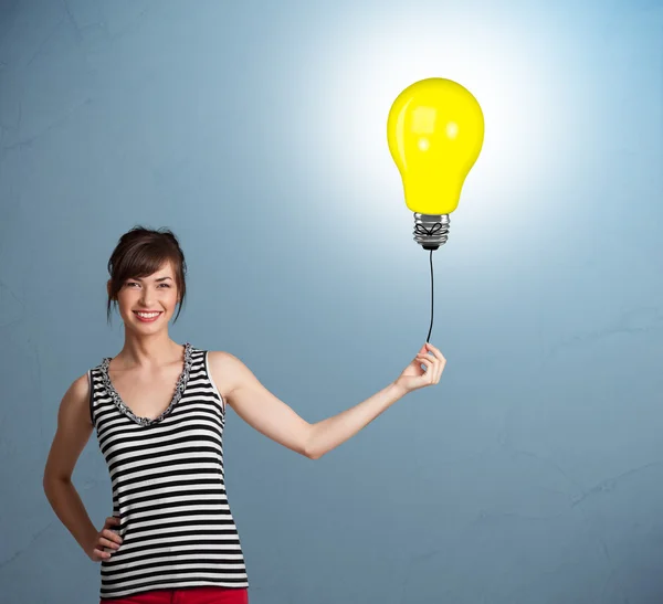 Pretty lady holding a light bulb balloon — Stock Photo, Image