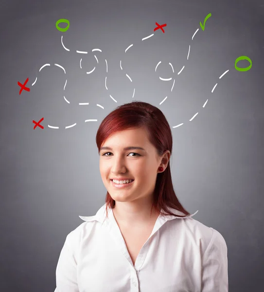 Young woman thinking with abstract marks overhead — Stock Photo, Image