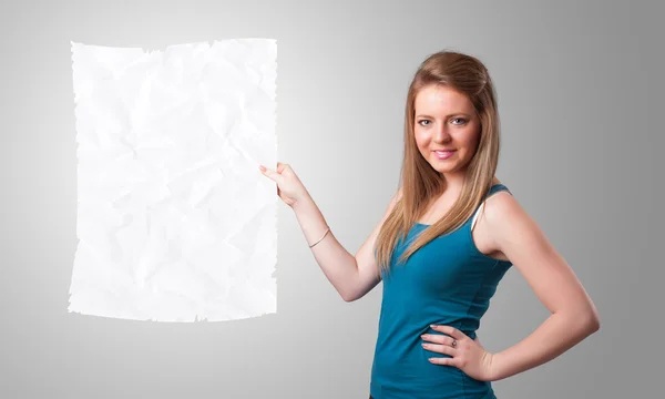 Young girl holding crumpled white paper copy space — Stock Photo, Image