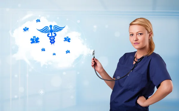 Junger Arzt mit abstrakter Wolke und medizinischen Ikonen — Stockfoto