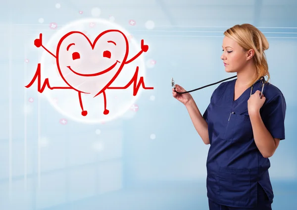 Attractive doctor with happy red smiling heart — Stock Photo, Image