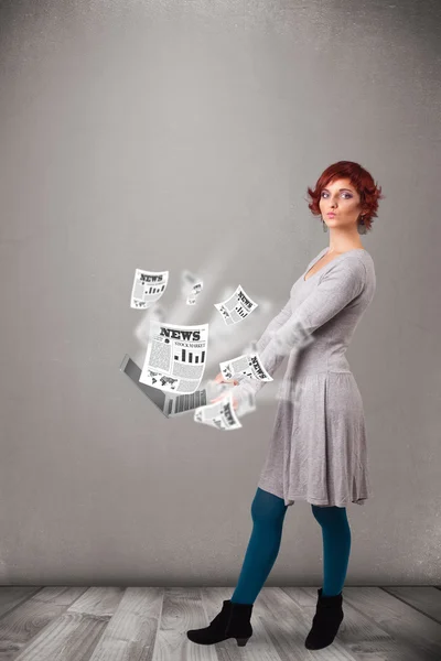 Casual young woman holdin notebook and reading the explosive new — Stock Photo, Image