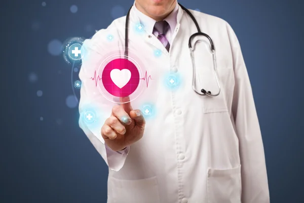 Middle aged doctor pressing modern medical type of button — Stock Photo, Image