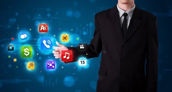 Businessman pressing various collection of buttons — Stock Photo, Image