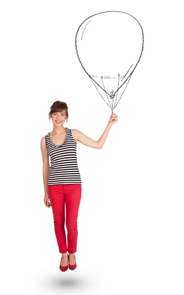 Ładna kobieta trzyma balon rysunek — Zdjęcie stockowe